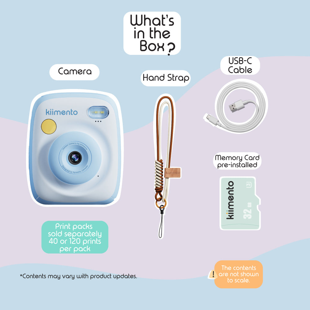 Sky blue instant print camera with USB-C cable, hand strap, and memory card.