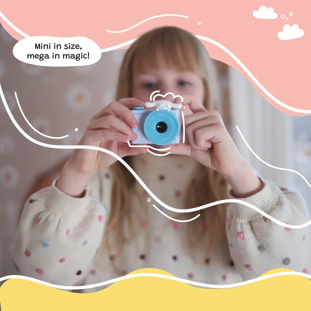 A child holding and aiming the kiimento Model A Cinnamoroll kids' digital camera, with playful graphic overlays and the caption “Mini in size, mega in magic!”.
