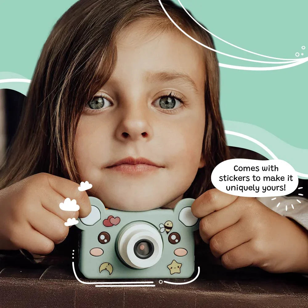 Young girl holding kiimento Model C Bear kids digital camera customized with fun stickers.