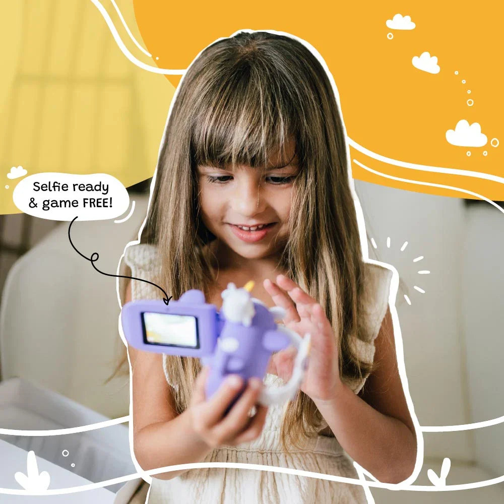 Young girl using the kiimento Model V unicorn kids digital camera indoors. Features visible include flip screen, selfie mode, and fun unicorn airplane design—perfect screen-free toy for ages 3 to 9.