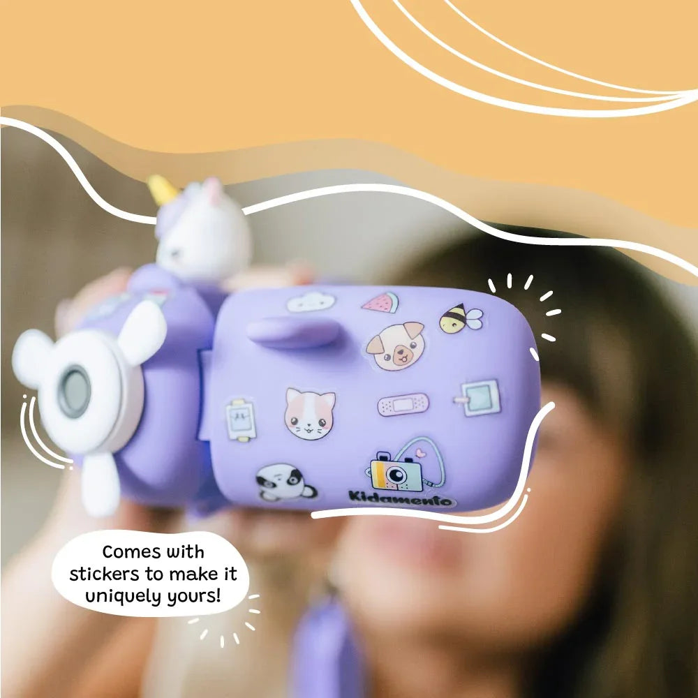 Close-up of kiimento Model V unicorn kids digital camera decorated with fun stickers. Showcases the airplane-shaped design and customization options—perfect for creative kids ages 3 to 9.