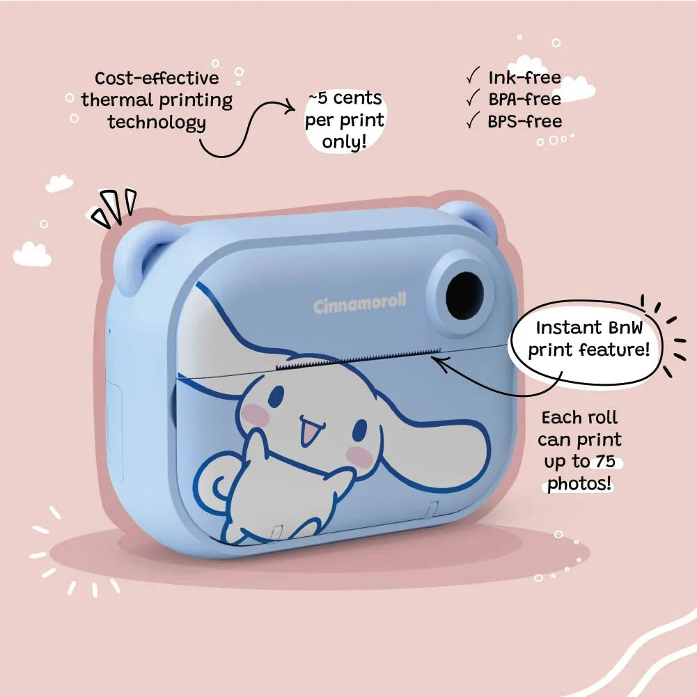 Angled view of the kiimento Model P Cinnamoroll kids’ digital camera on a pink background, highlighting the instant black-and-white print feature, cost-effective thermal printing (~5 cents per print), and eco-friendly qualities: ink-free, BPA-free, and BPS-free.