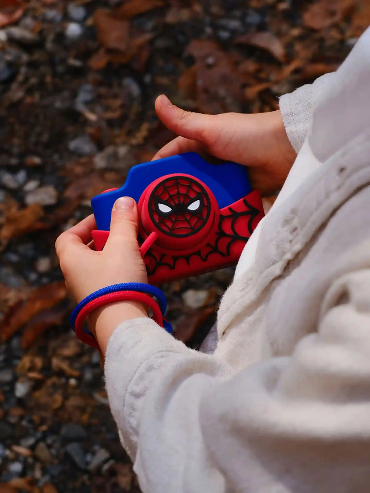 Child holding kiimento Marvel Spider-Man Digital Camera Model K – red and blue touchscreen kids camera
