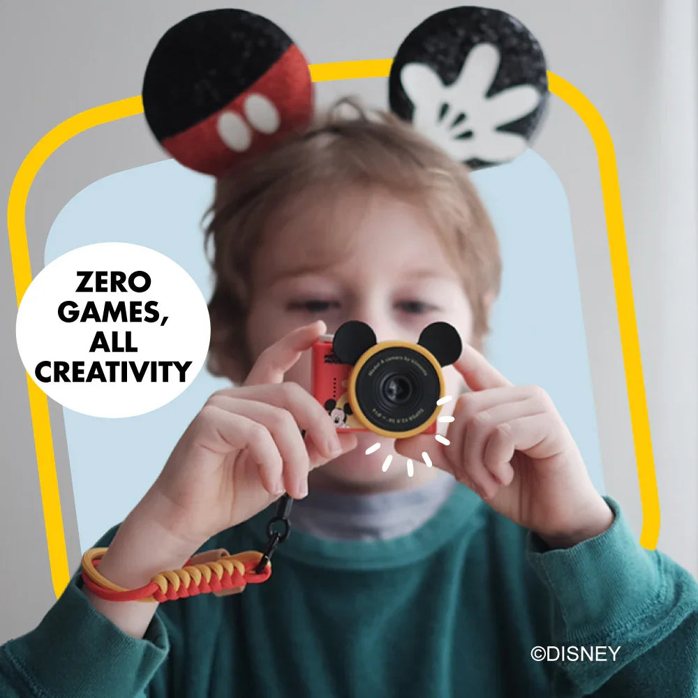 Mickey Mouse mini camera with Mickey ears and a yellow and red wrist strap.