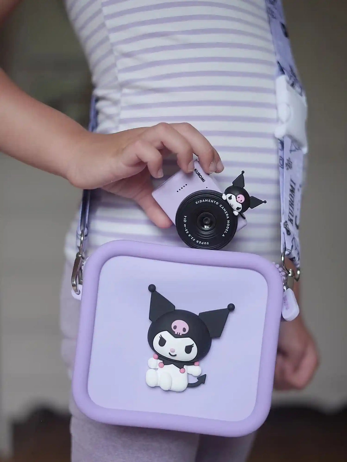 Child holding kiimento Sanrio Kuromi Mini Camera Model A and Kuromi Camera Bag – matching Sanrio gift set